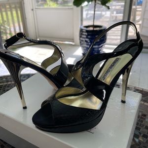 Ladies Charles David heels in patent leather and black snake skin upper.